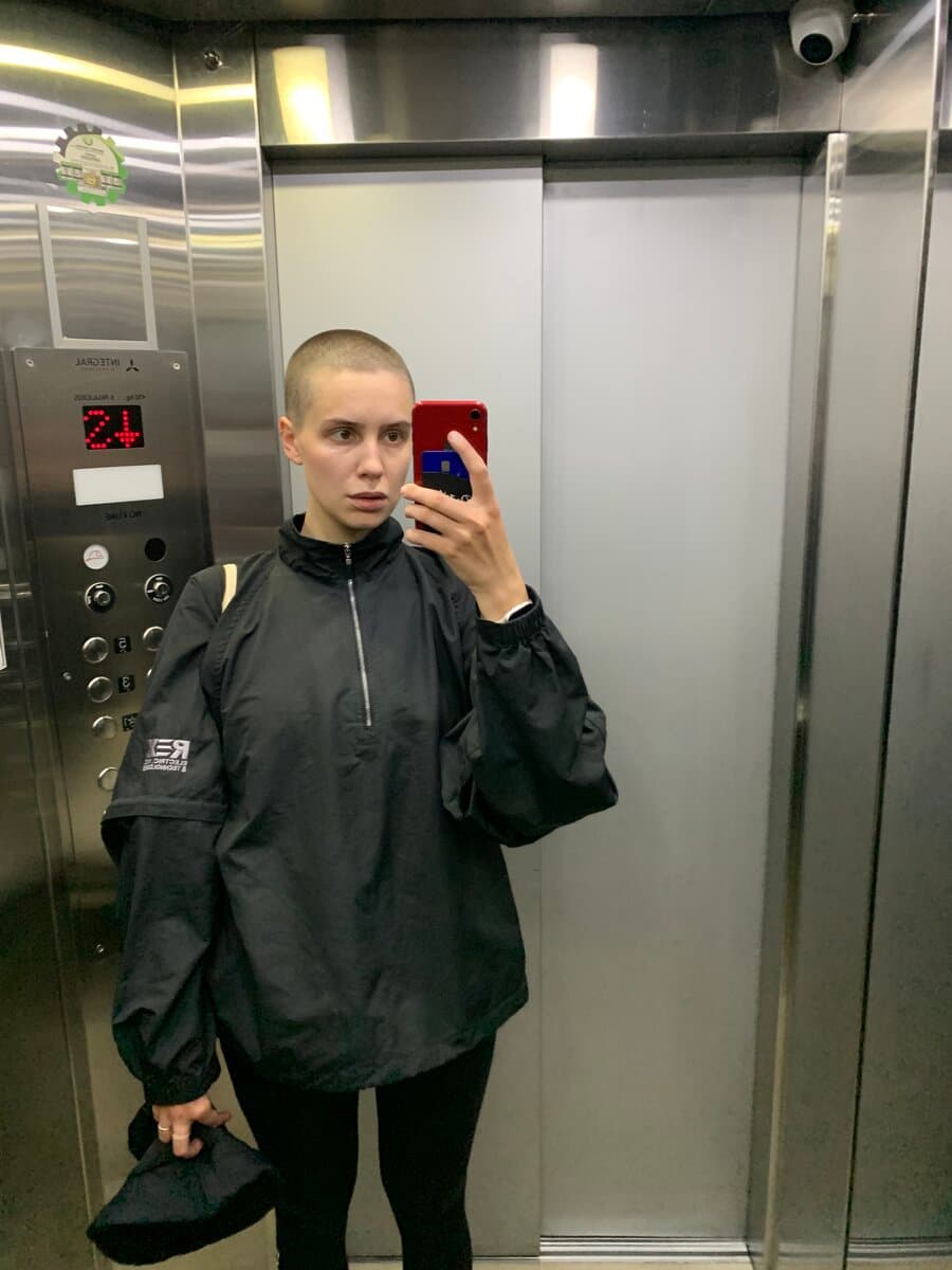 With my head shaved, a mirror selfie in an elevator